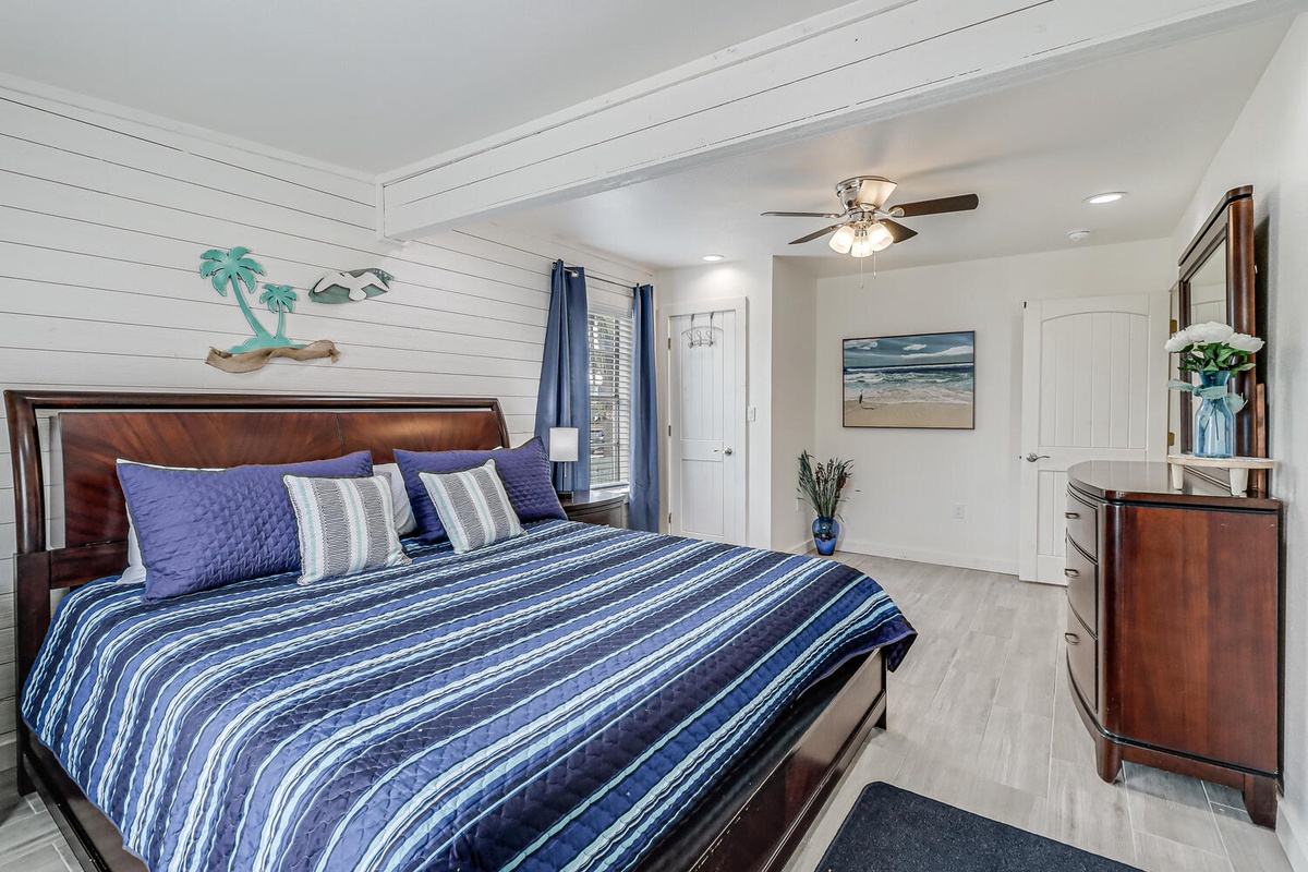 Sink into your private coastal retreat with crisp blue linens and beach-inspired décor creating the perfect setting for peaceful nights.