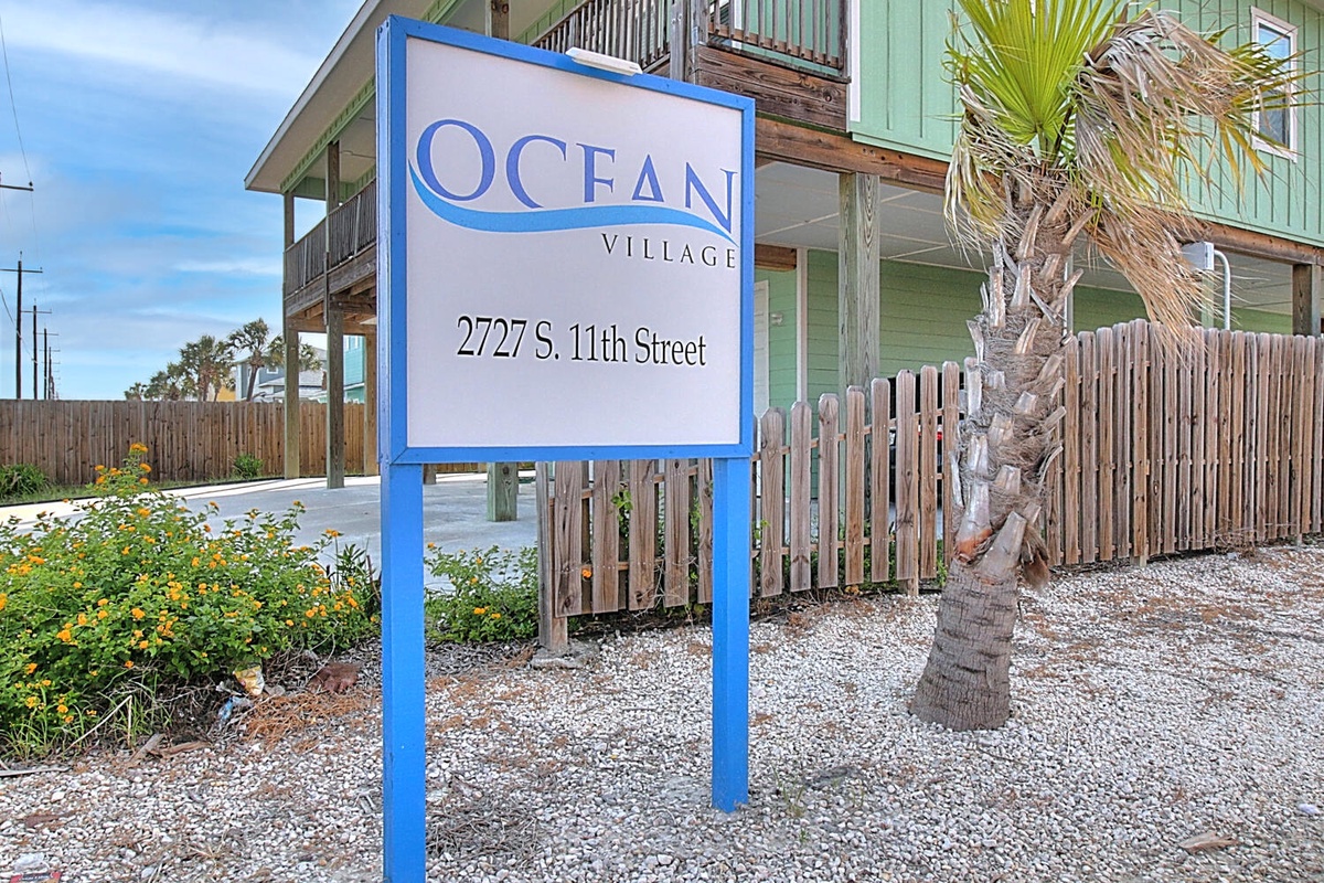 Welcome to Ocean Village, where coastal charm awaits at this beachside retreat with tropical landscaping and authentic beach house architecture.