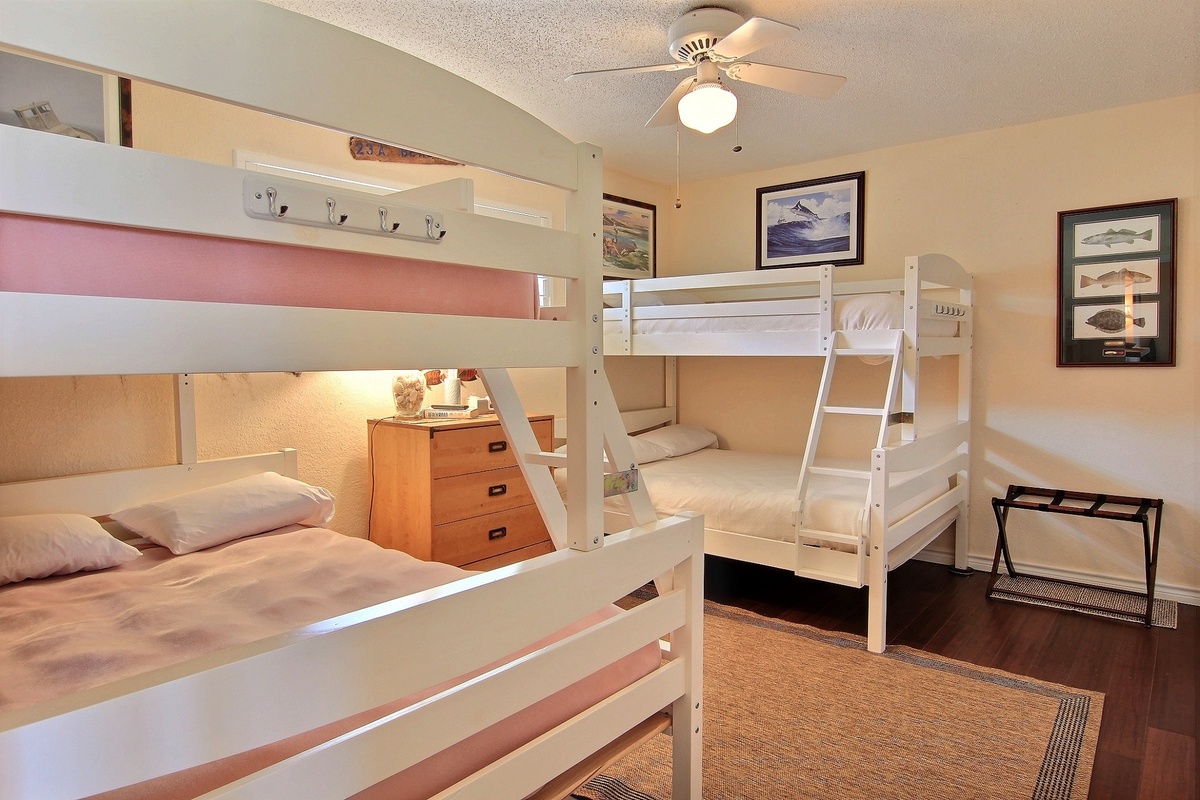 Your family will love this cheerful bunk room, where kids can create memories while parents appreciate the thoughtful storage and cozy nautical touches.