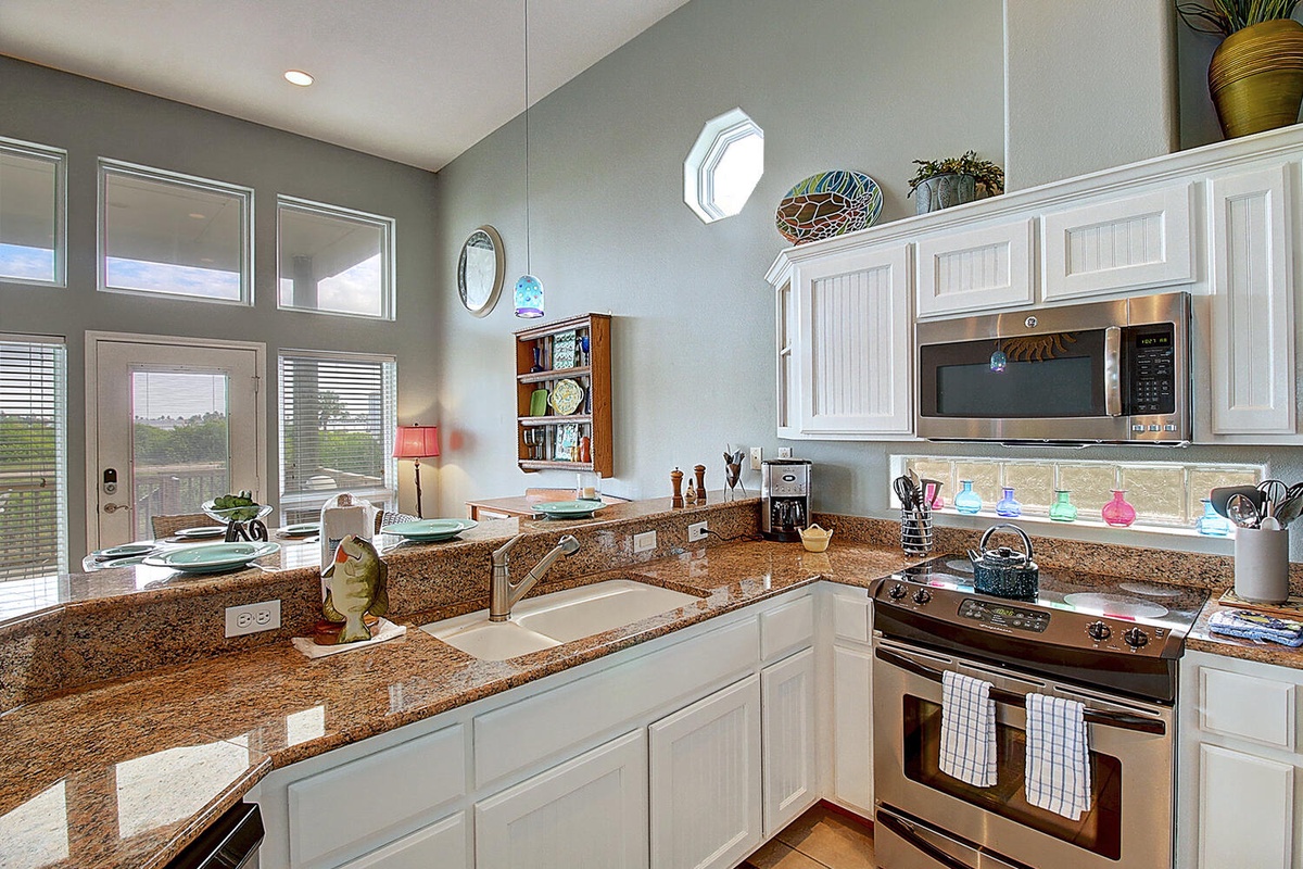Whip up memorable meals in your spacious kitchen with granite counters, stainless appliances, and abundant natural light streaming through multiple windows.