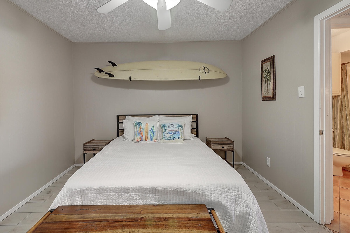 Drift to sleep in your surf-themed bedroom, complete with a real surfboard wall display and crisp linens.