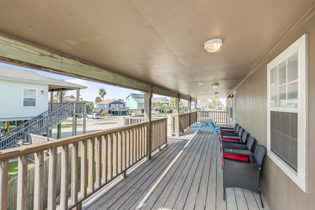 Your private deck stretches the length of the home, offering comfortable seating and coastal neighborhood views for morning coffee or sunset relaxation.