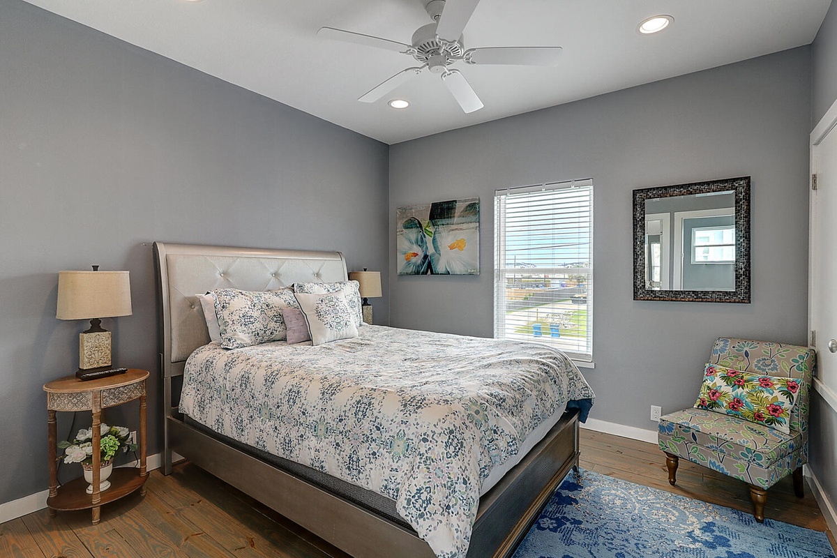Relax in your peaceful bedroom with soothing gray walls and artistic touches that create the perfect retreat.