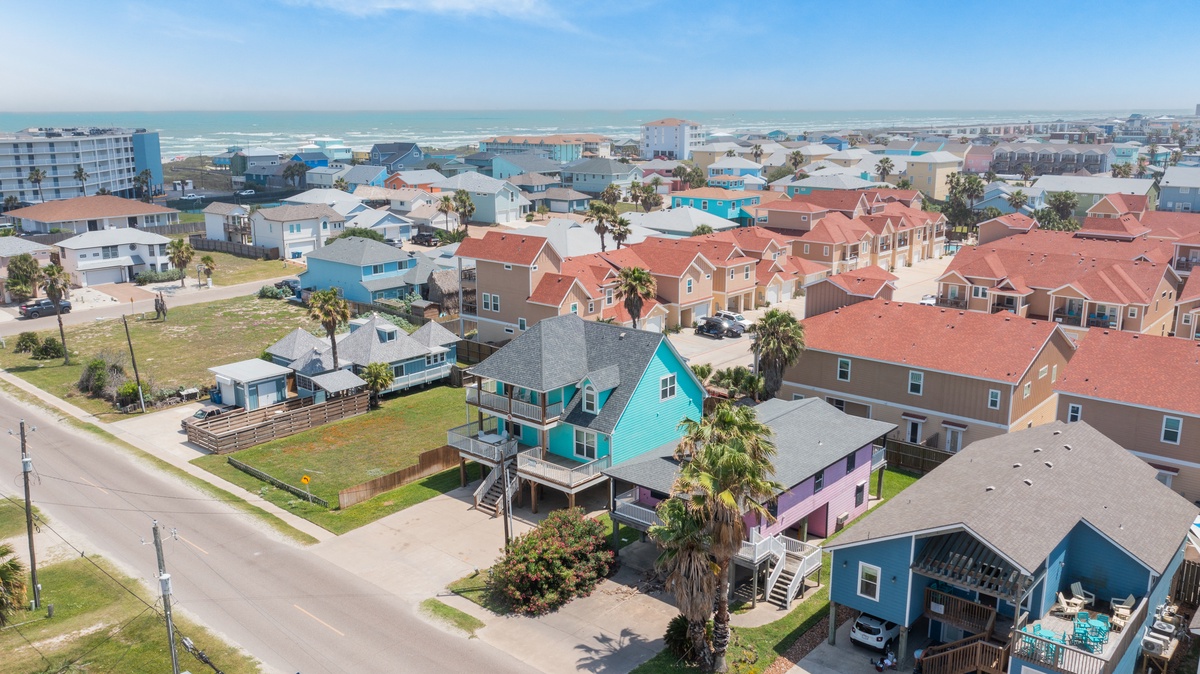 Colorful beachfront neighborhood showcasing vibrant coastal homes just steps from the Gulf of Mexico shoreline.