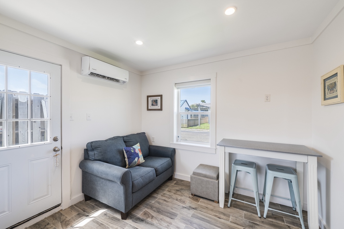 Settle into your bright, air-conditioned retreat with a cozy sofa and high-top seating—perfect for unwinding after exploring the area.