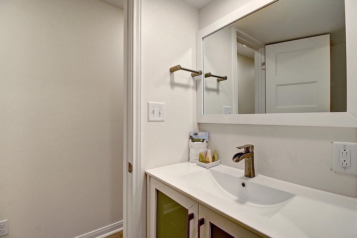 Your modern bathroom features a sleek vanity with premium fixtures and thoughtful amenities to make your morning routine effortless.