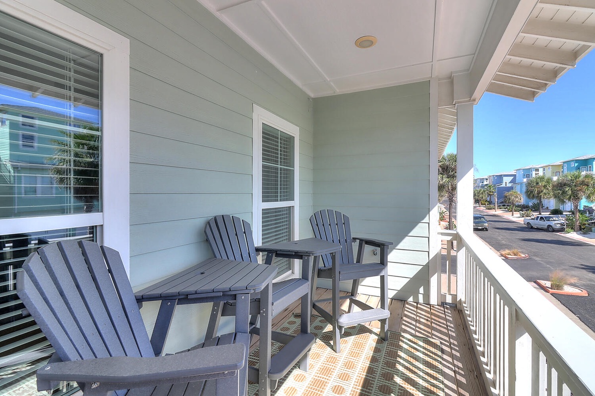 Your private balcony awaits with comfortable seating for morning coffee or evening sunset views overlooking the peaceful neighborhood.