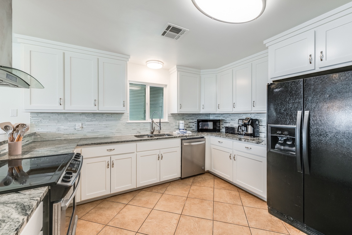 Your fully equipped kitchen features granite countertops, stainless steel appliances, and ample cabinet space for all your culinary adventures.