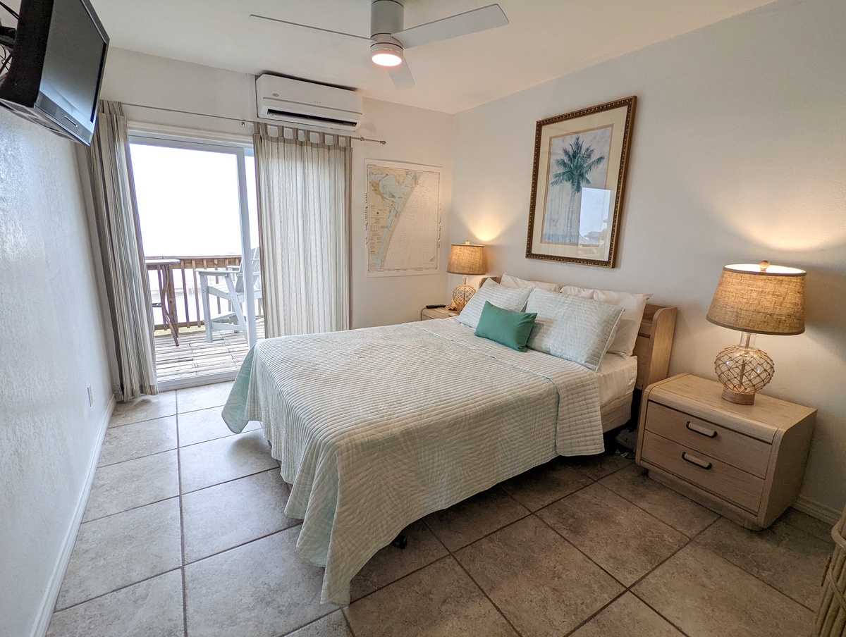 Your coastal bedroom awaits with tropical touches and a private balcony where gentle breezes and ocean views create perfect morning moments.