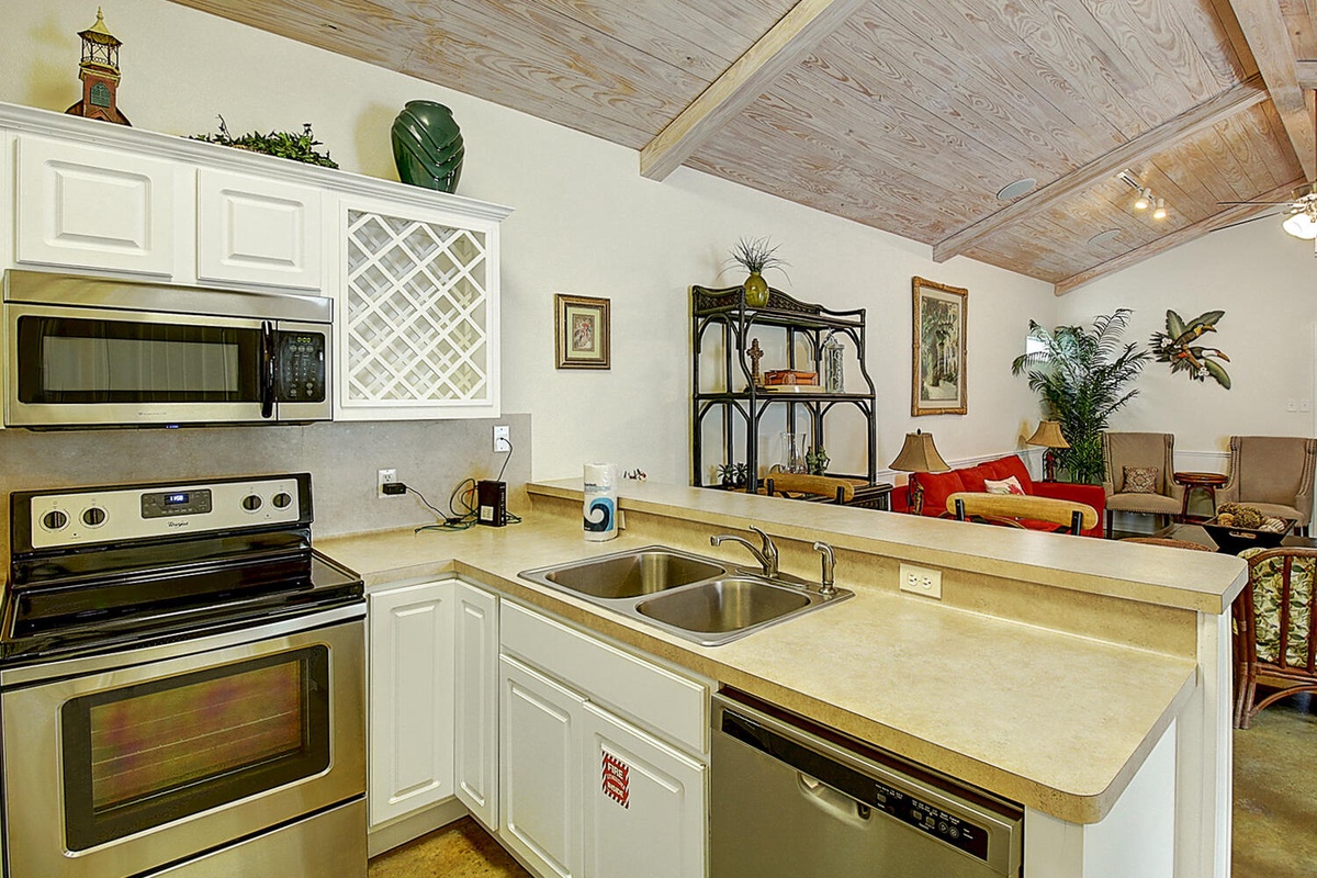 Your fully equipped kitchen opens to the living area, perfect for preparing meals while staying connected with family and friends.