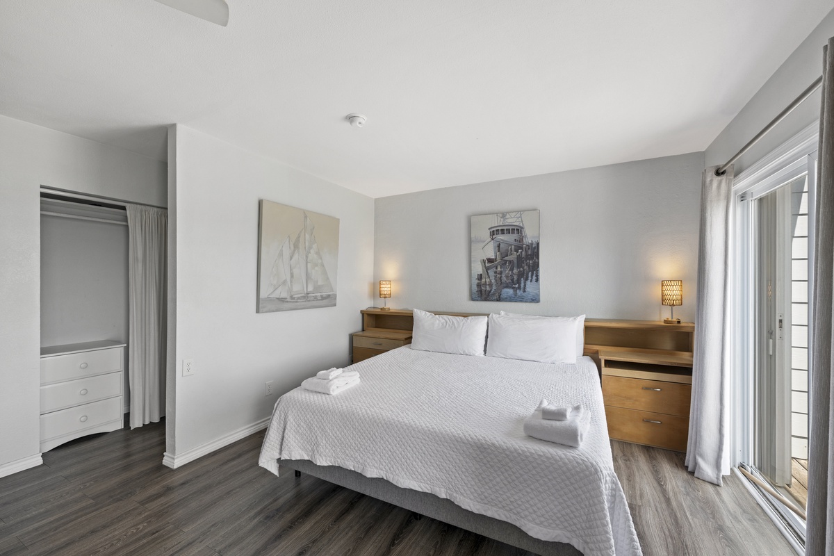 Rest peacefully in your serene bedroom featuring crisp linens, warm lighting, and nautical touches that create the perfect coastal retreat atmosphere.