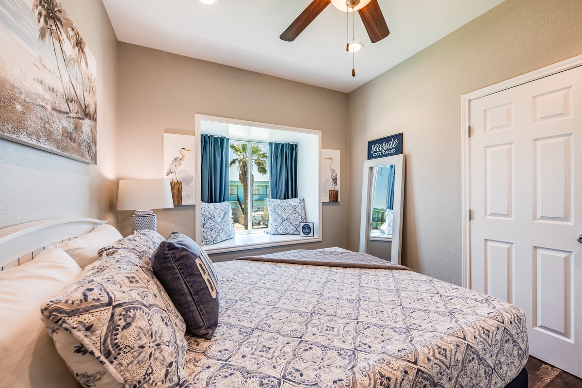 Wake up to coastal charm in your serene bedroom, where soft blues and warm tones create the perfect beachside retreat.
