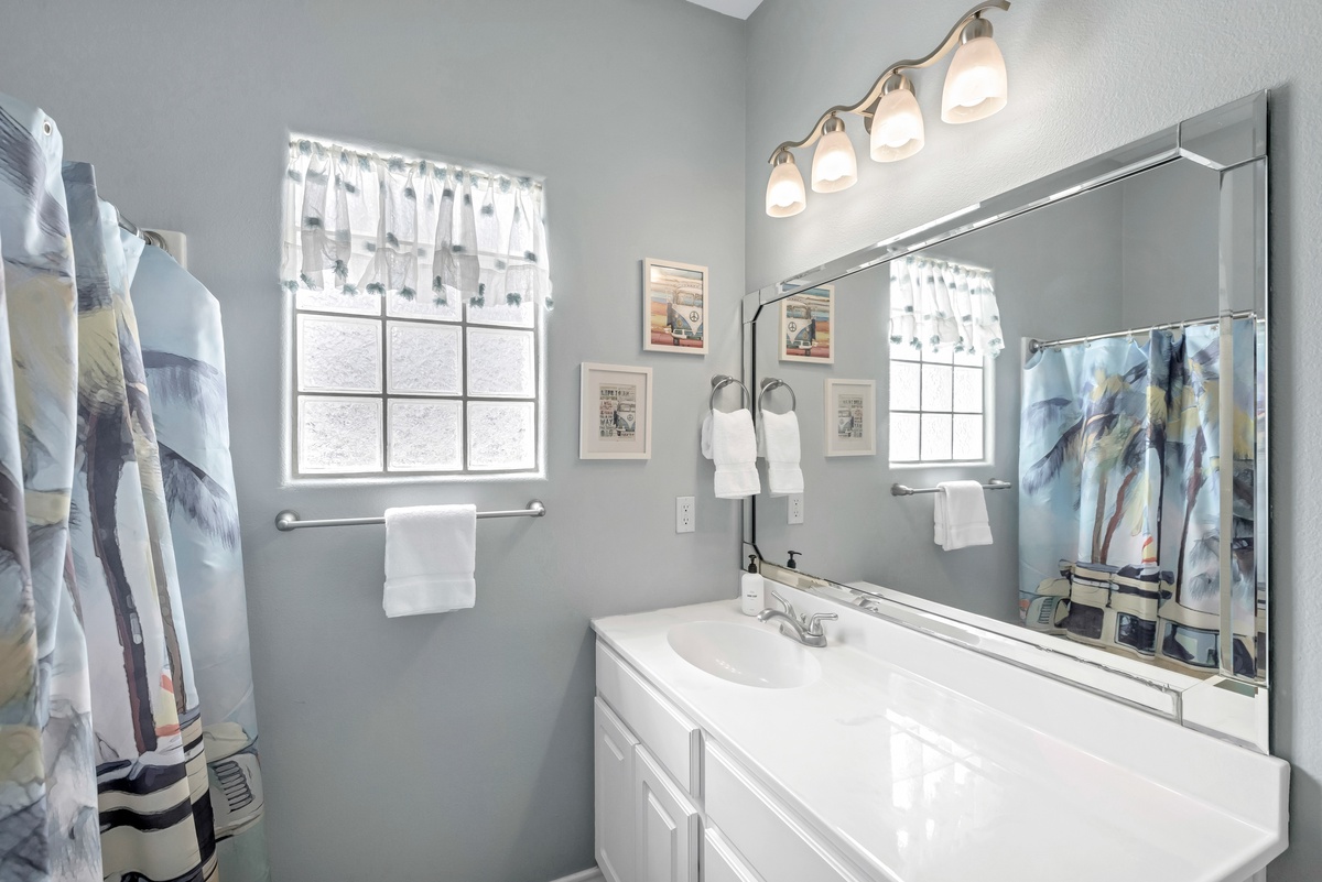 Step into your bright, clean bathroom with fresh towels and thoughtful touches for your comfort.