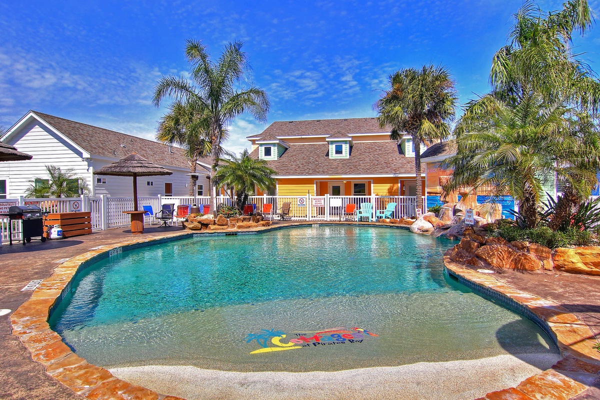 Dive into your private tropical oasis with crystal-clear waters, palm trees swaying overhead, and sunny poolside lounging waiting for you.