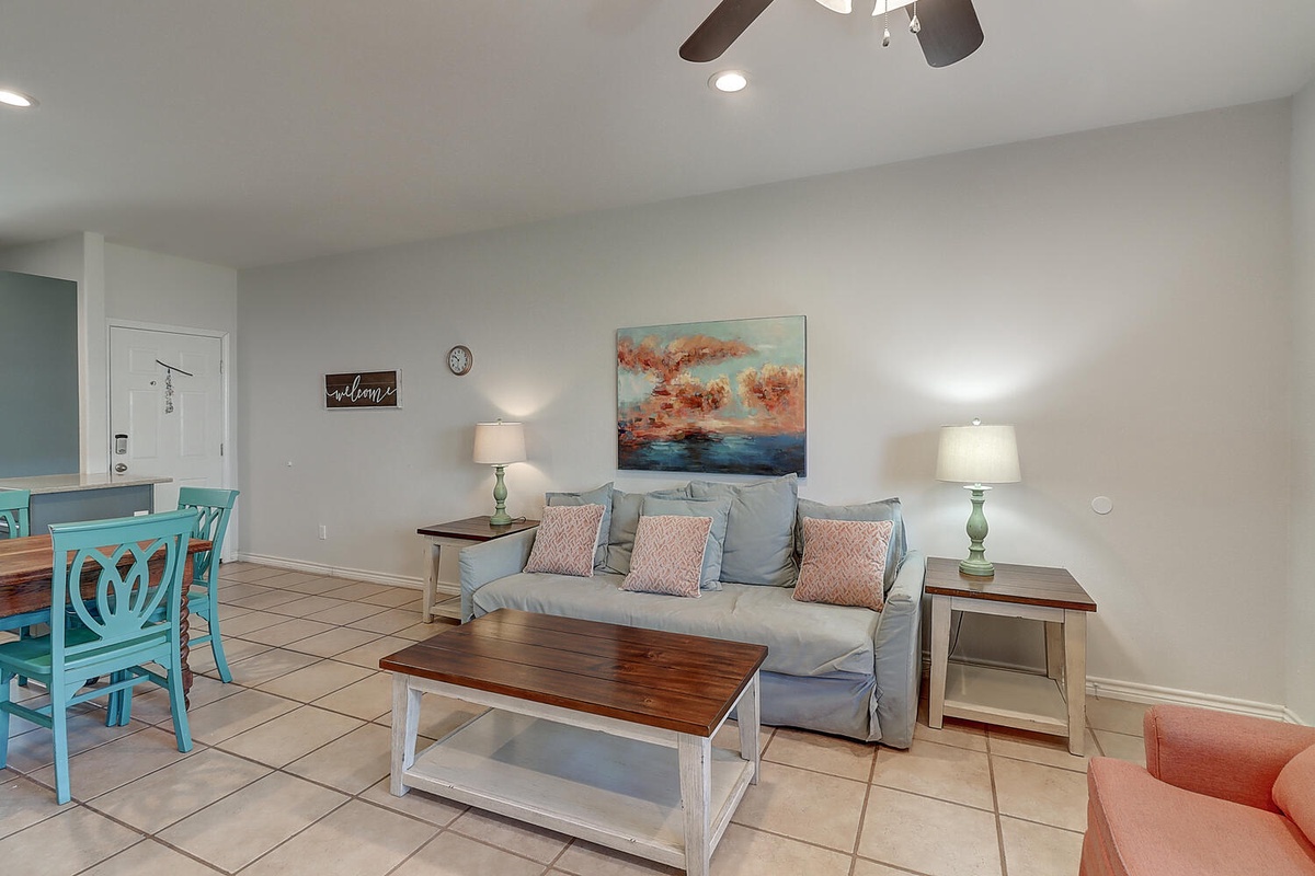 Relax in your bright, airy living space with coastal charm. Soft blues and warm woods create a tranquil atmosphere for your getaway.
