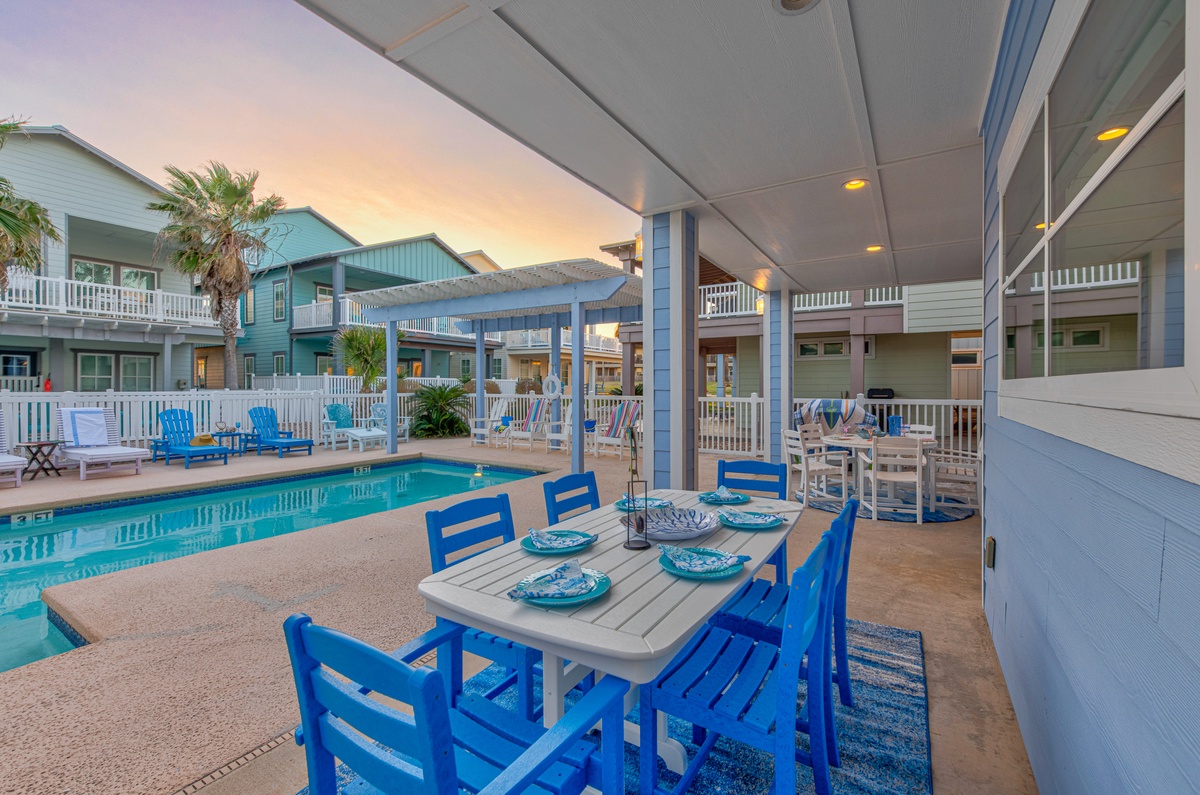 Gather your group around this inviting poolside dining table, where evening meals become magical under the covered patio with pool views.