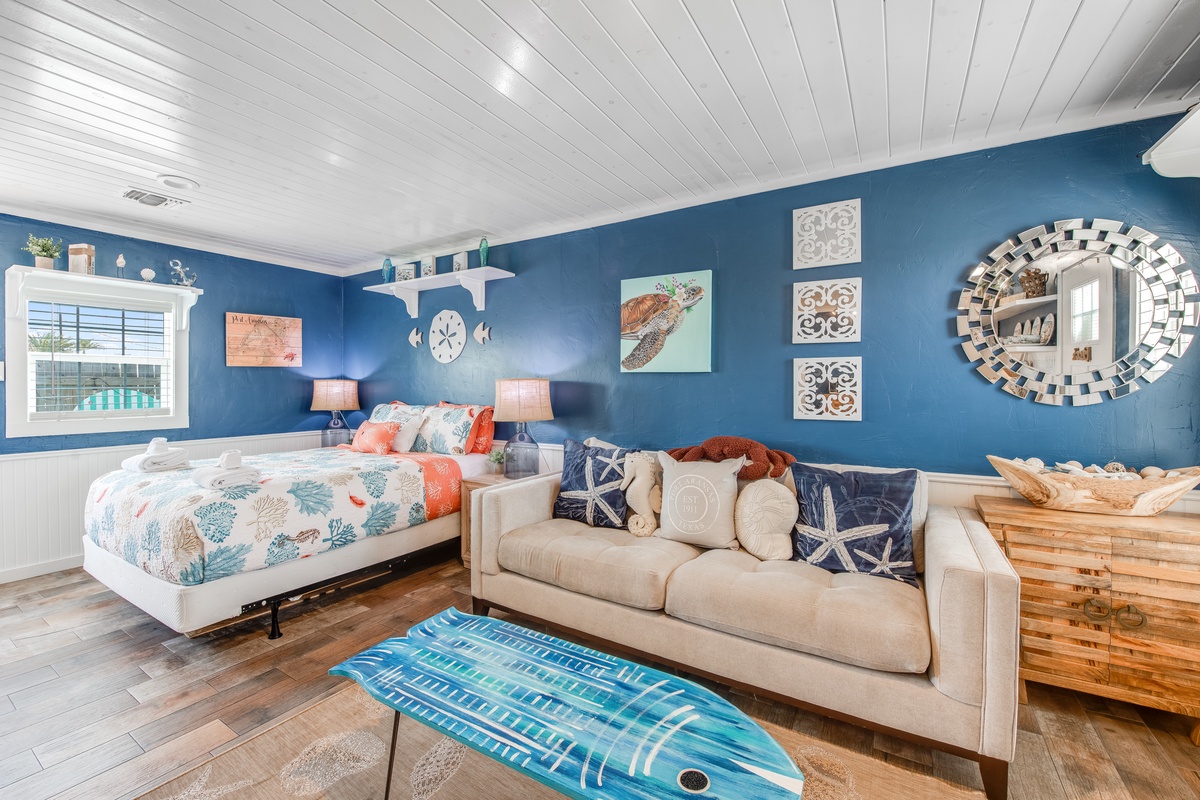 Relax in your coastal-themed living room with ocean blues, comfy seating, and charming nautical touches that make you feel steps from the shore.