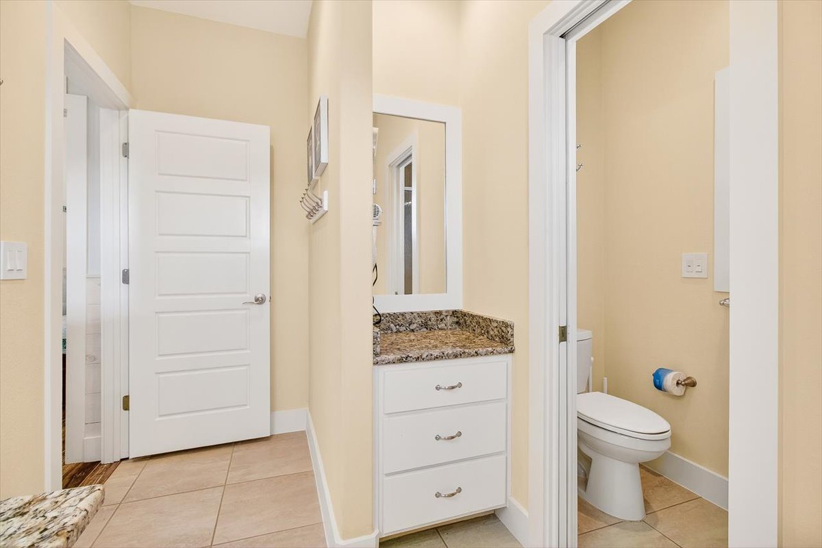 Your private bathroom features modern fixtures and built-in storage, creating a clean and convenient space for your daily routine.