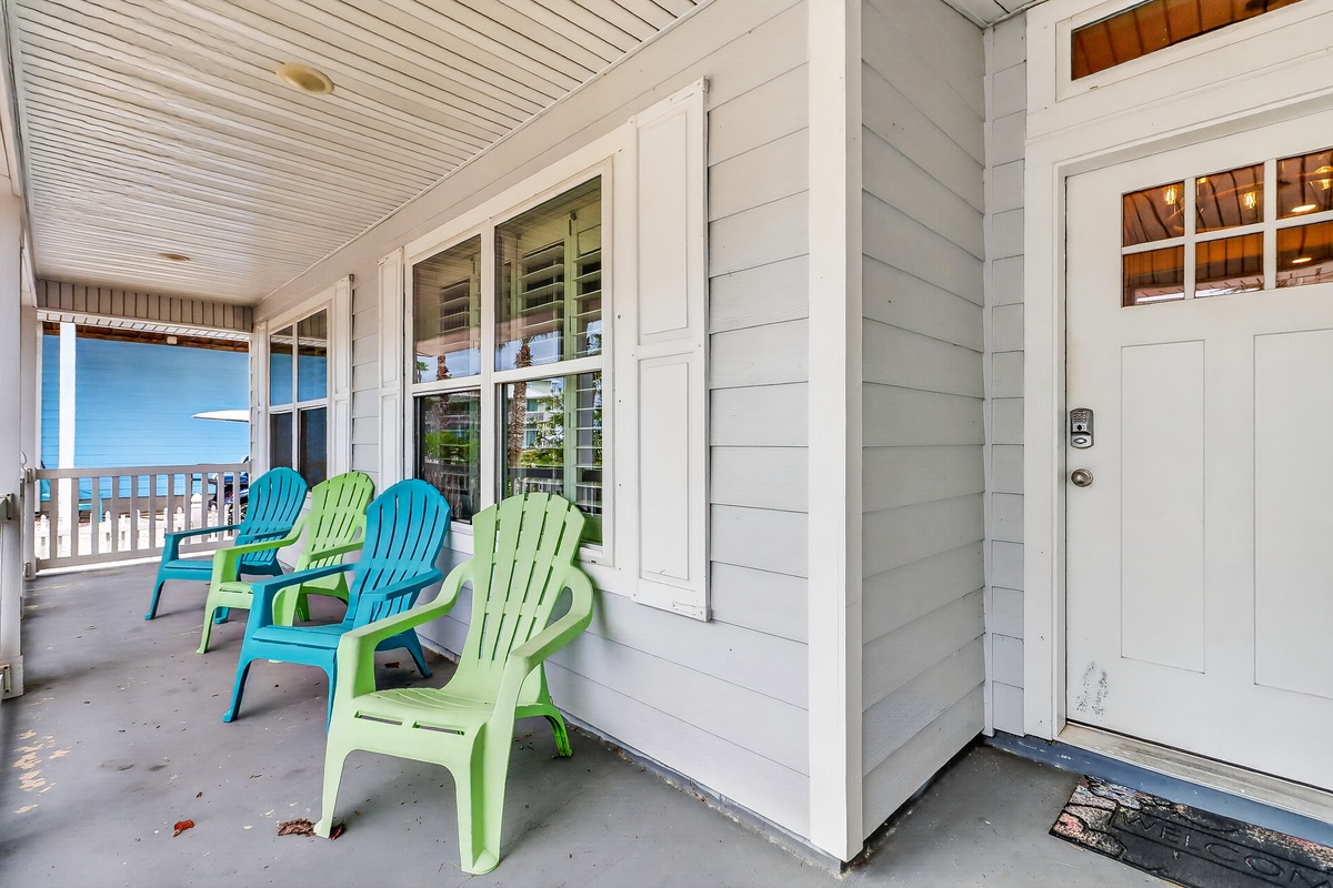 Settle into your colorful Adirondack chairs on this charming covered porch, where you can sip morning coffee while watching the world wake up.