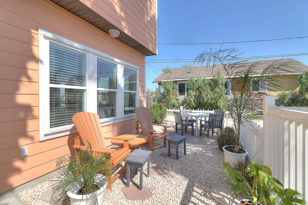 Your private terrace awaits with comfortable seating and tropical touches, perfect for morning coffee or evening relaxation.
