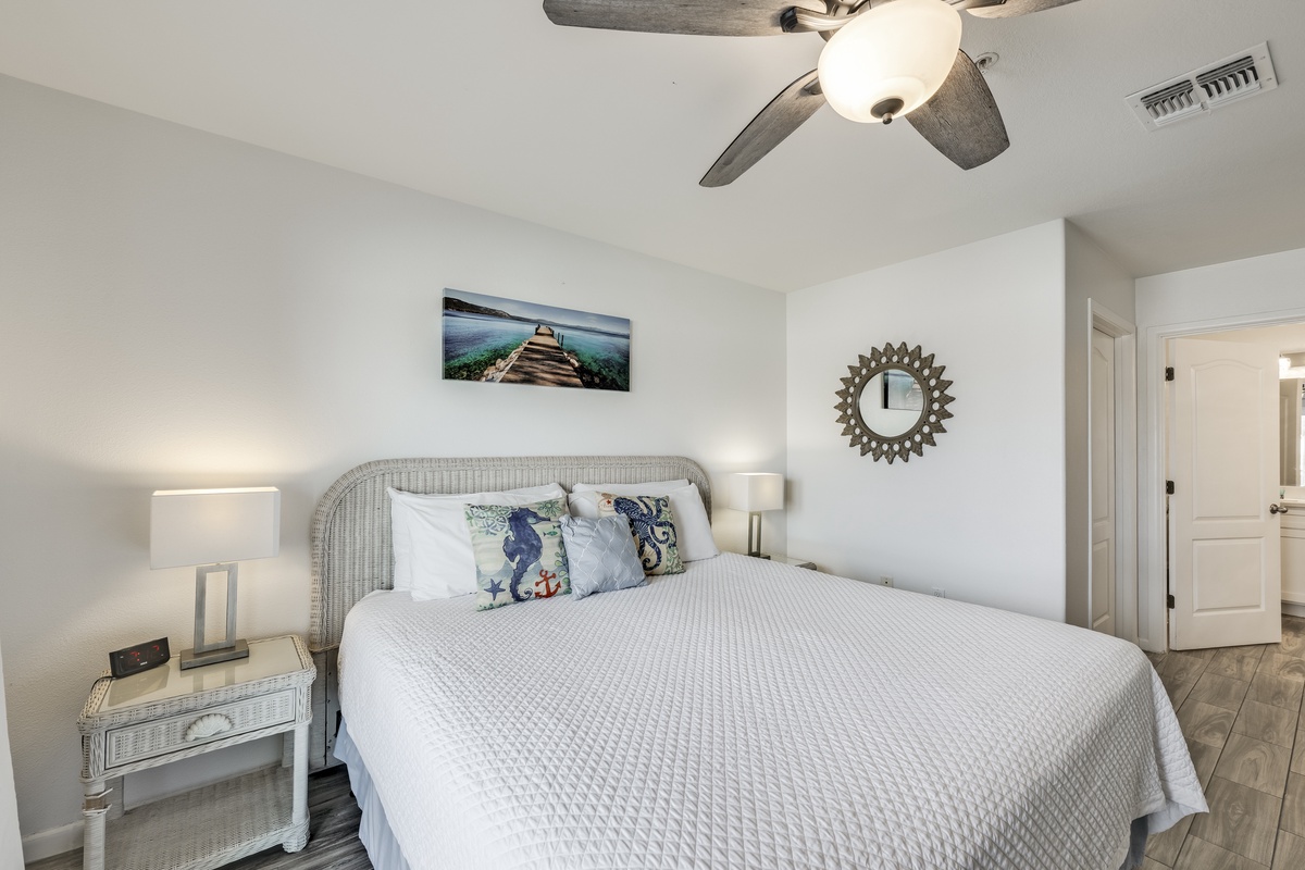 Drift into relaxation in your coastal-inspired bedroom with plush bedding, soft lighting, and calming decor that makes unwinding feel effortless.