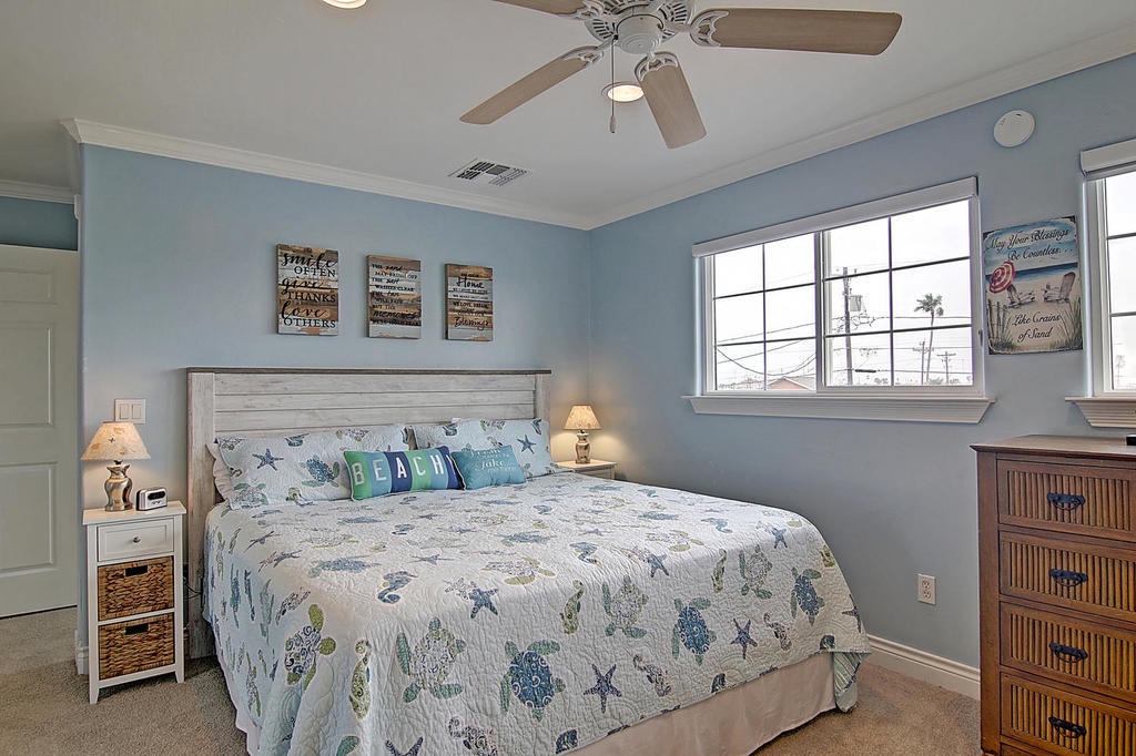 Drift into peaceful sleep in your coastal-themed bedroom, where ocean-inspired décor and soft blue walls create the perfect beach getaway ambiance.