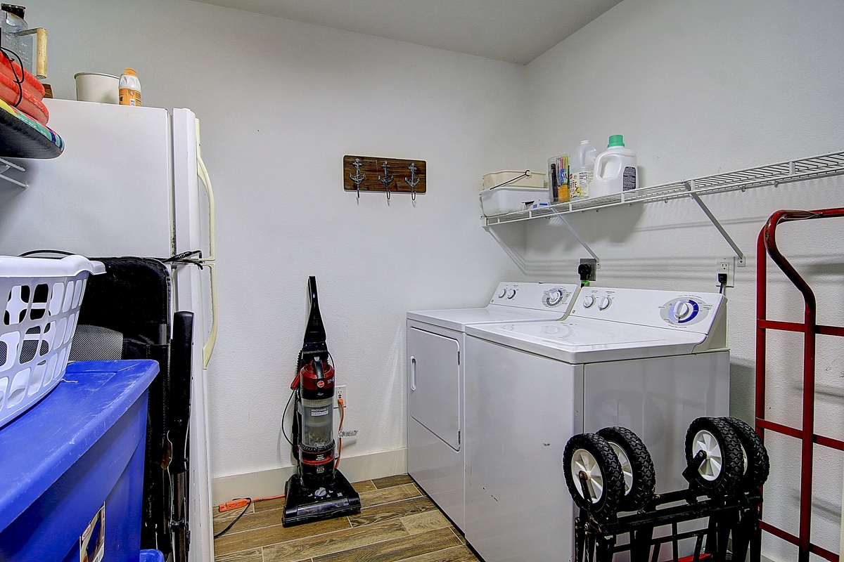 Your dedicated laundry space keeps you organized with side-by-side washer and dryer, plus storage shelving for all your essentials.