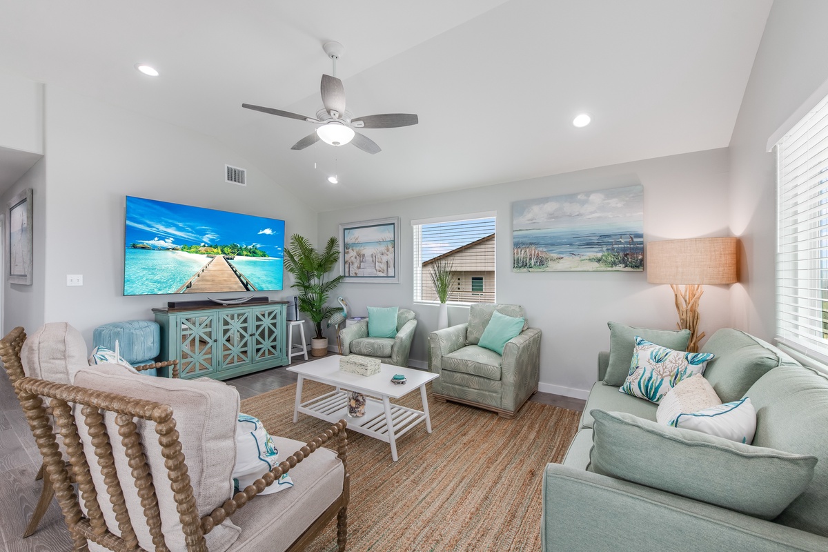 Sink into plush coastal seating surrounded by soothing sea-glass tones and tropical artwork that brings the beach right to your doorstep.