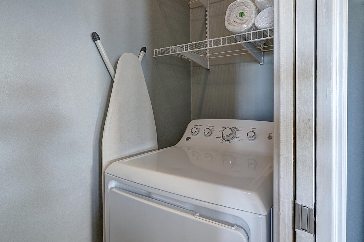 Your private laundry closet makes staying fresh effortless with a full-size washer, ironing board, and towels ready for use.