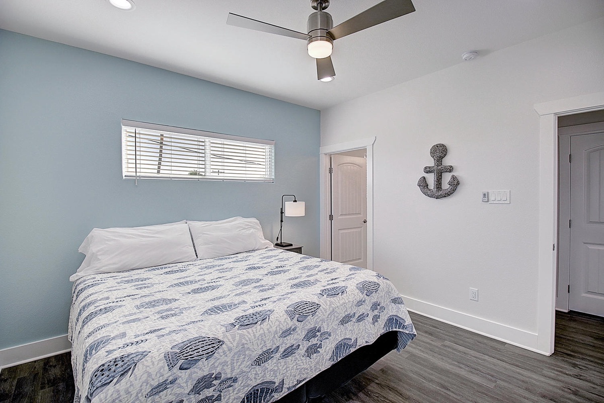 Drift off in your coastal bedroom with nautical touches, soft linens, and gentle ceiling fan creating the perfect sleep sanctuary.