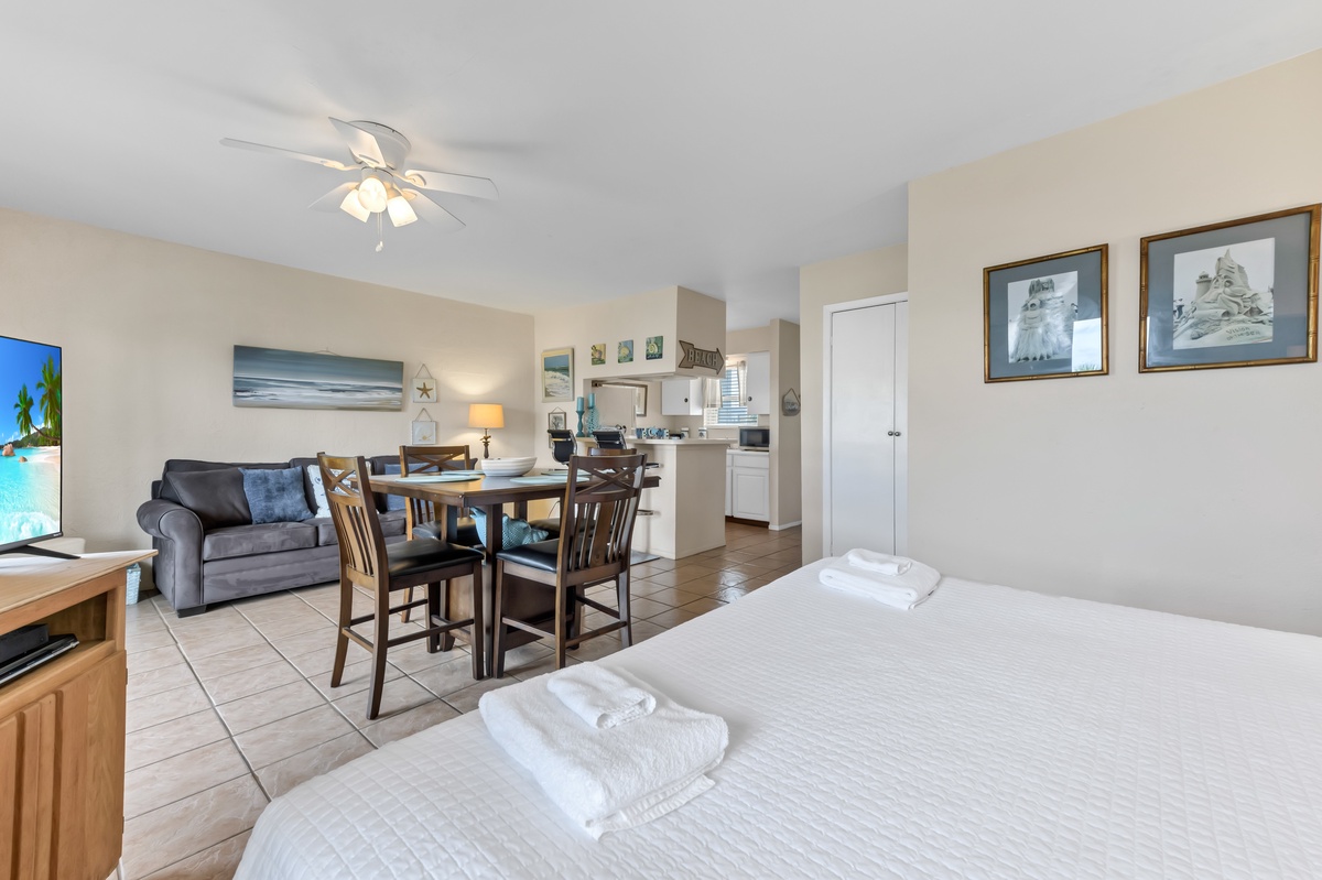 Relax in your spacious studio where coastal charm meets comfort, featuring fresh linens and an open layout perfect for unwinding.