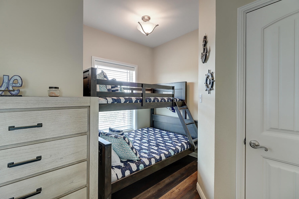 Your kids will love this cozy bunk room with nautical touches and plenty of storage for all their vacation treasures.