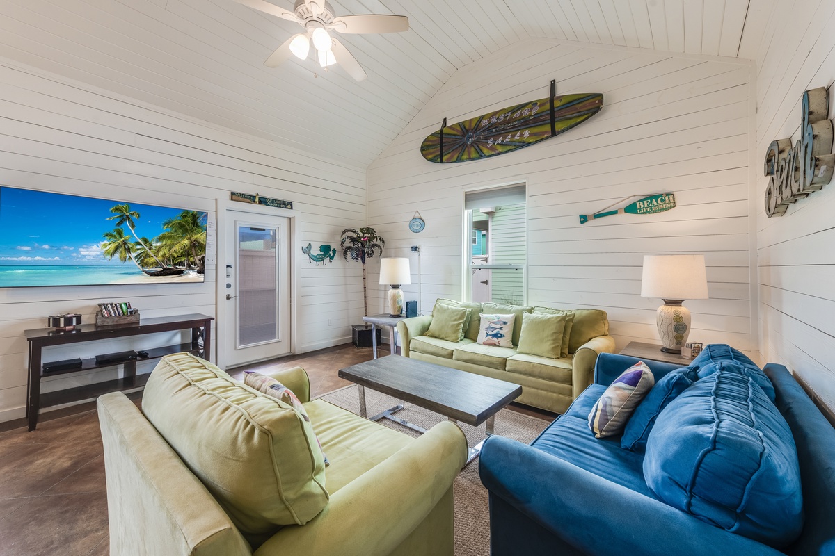 Sink into coastal comfort in your beach-themed living room, where surfboard décor and ocean views create the perfect seaside escape.