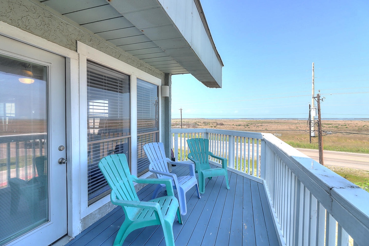 Step onto your private balcony and settle into colorful Adirondack chairs overlooking endless coastal views.
