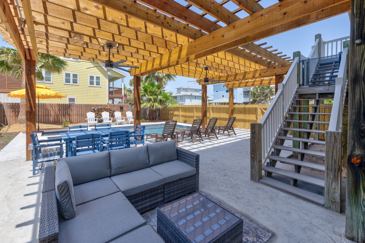 Relax under your private pergola with pool views and multiple outdoor seating areas for ultimate vacation comfort.