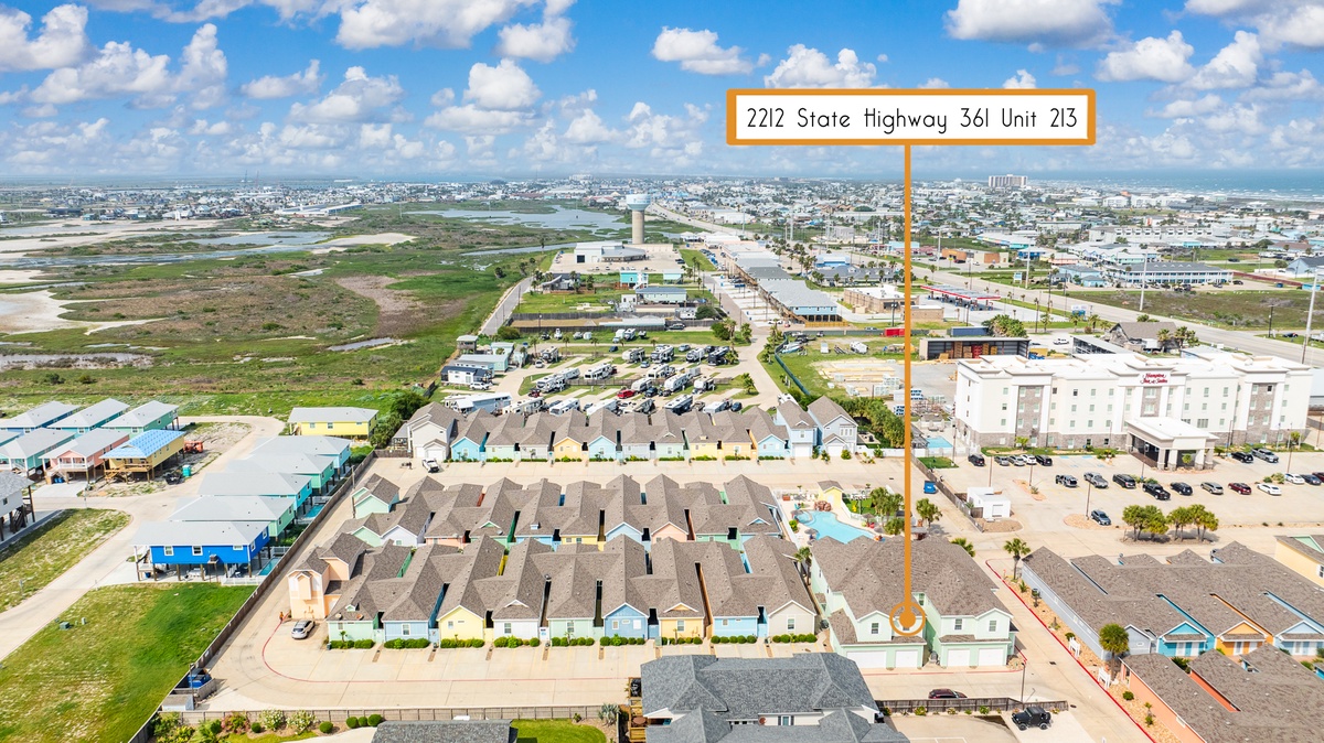 Aerial view of the coastal community showing the property's location along State Highway 361 Unit 213.