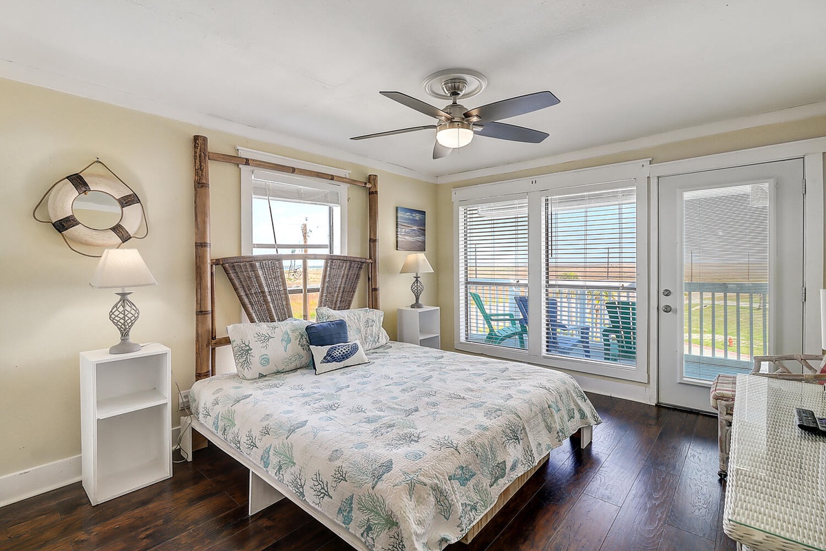 Wake up in this coastal-themed bedroom where ocean breezes flow through your private balcony doors and nautical touches create pure seaside serenity.
