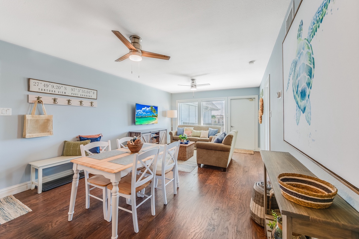 Relax in your coastal-themed living space with ocean-inspired décor, comfortable seating, and dining area perfect for memorable meals together.