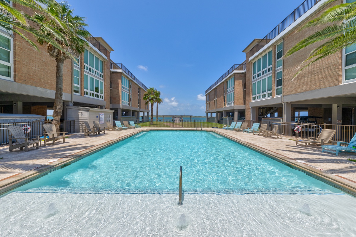 Dive into crystal-clear waters surrounded by tropical palms and modern comfort. Your perfect poolside retreat awaits just steps from turquoise ocean views.