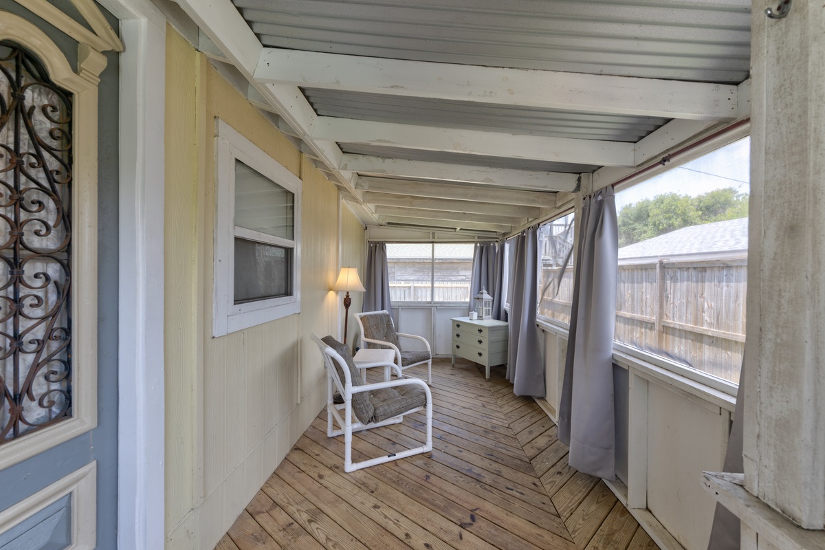Settle into your private screened porch, where soft breezes and the gentle creak of wooden floors invite peaceful afternoons with a book or morning coffee in hand.