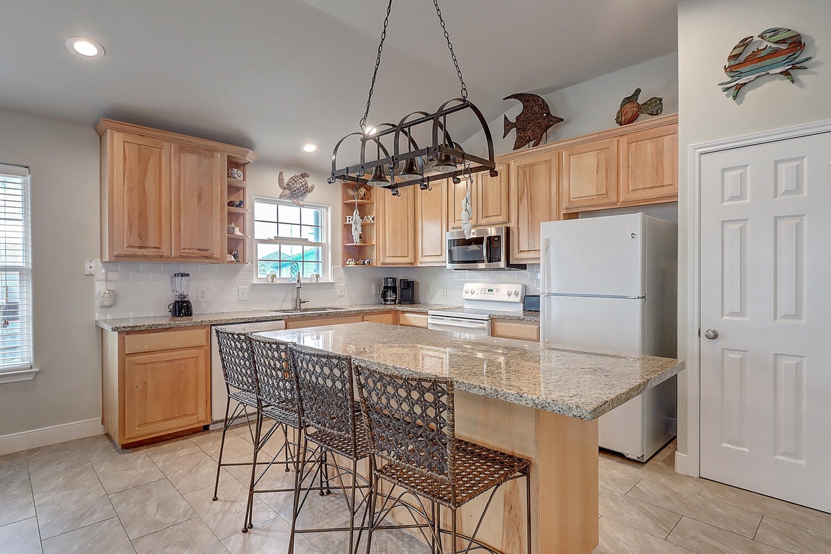 Your fully equipped kitchen features granite countertops and an island where you can prepare meals and gather with loved ones.