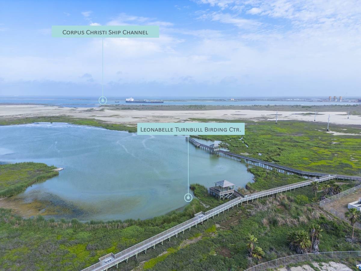 Aerial view showcases the Leonabelle Turnbull Birding Center and nearby Corpus Christi Ship Channel as prominent area landmarks.