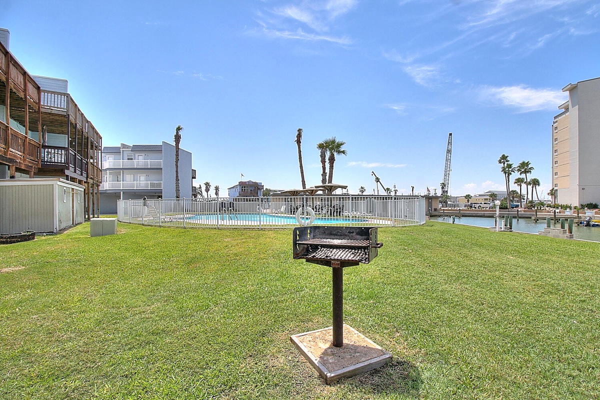 Fire up the grill for your waterfront barbecue while enjoying views of the marina and sparkling pool just steps away.