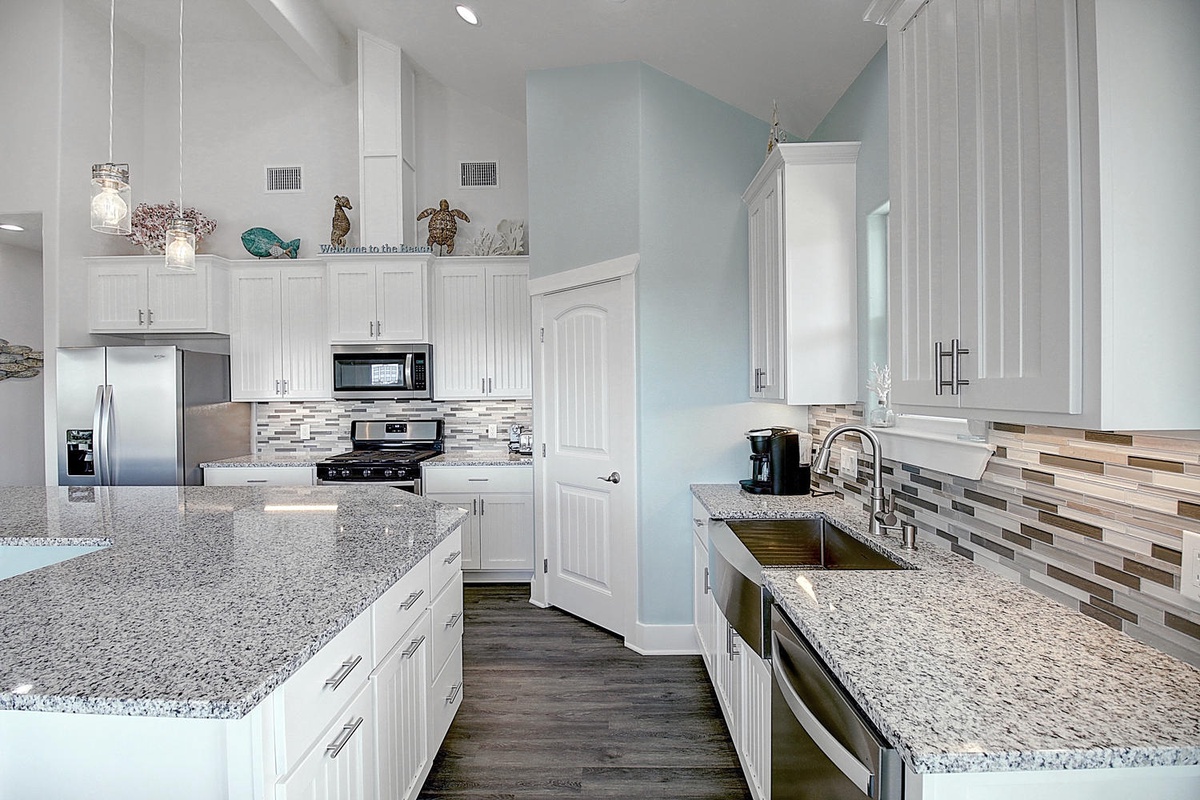 Cook memorable meals in your fully equipped kitchen with granite counters, stainless steel appliances, and coastal-inspired décor.