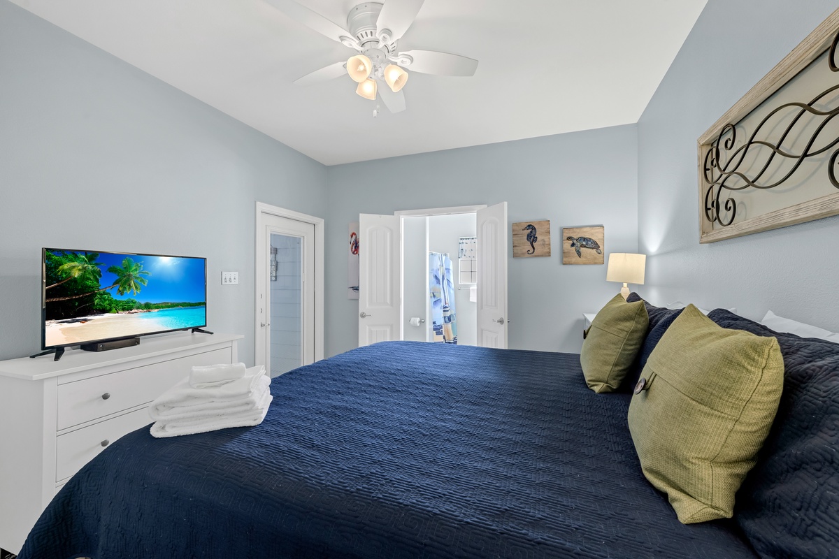 Sink into your cozy bedroom with tropical beach views on the flatscreen TV and calming coastal colors throughout.