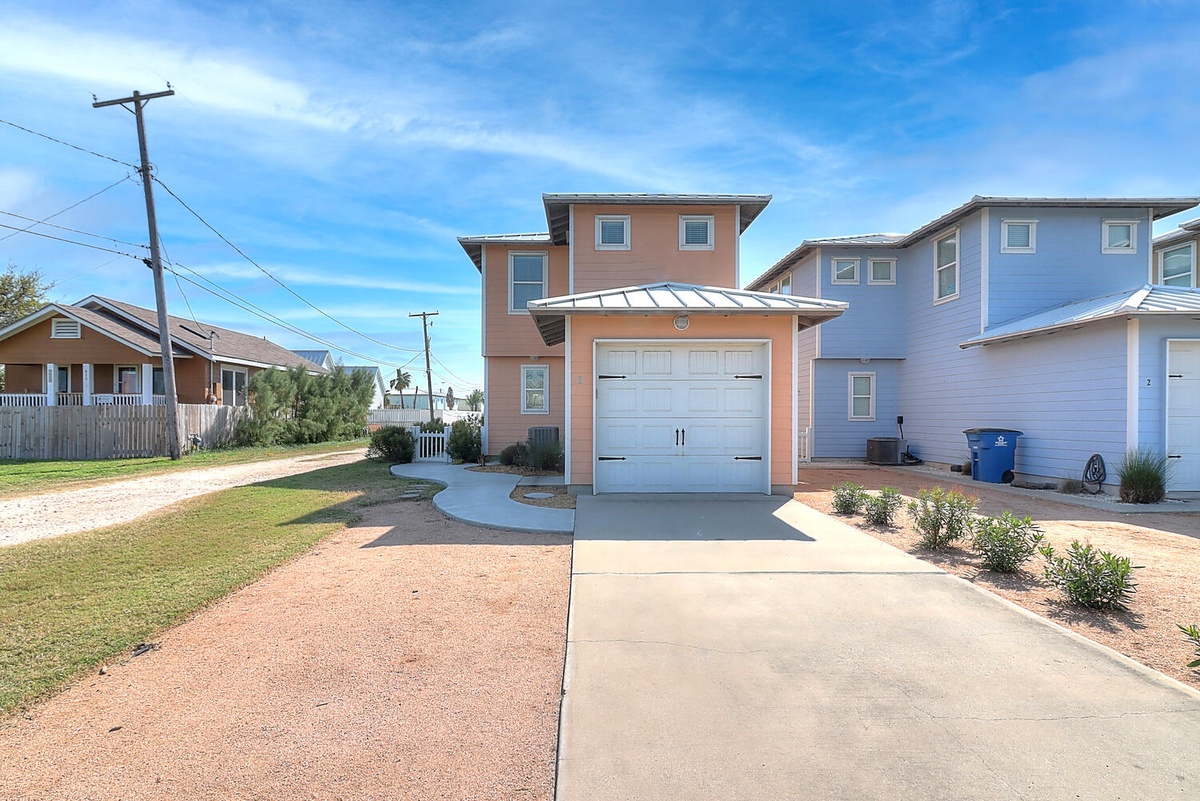 Charming coastal home with convenient garage parking in a friendly neighborhood setting.