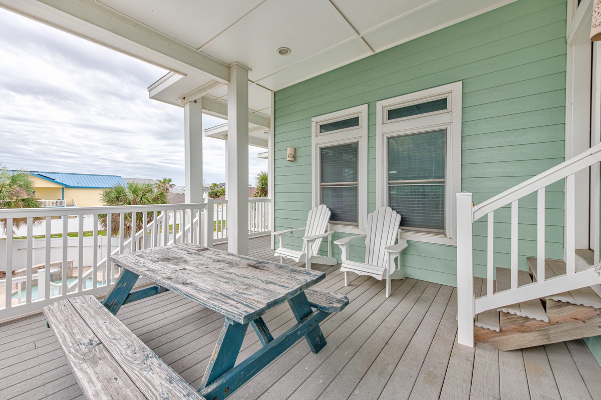 Unwind on your private covered deck with Adirondack chairs and picnic table, perfect for morning coffee or evening relaxation.
