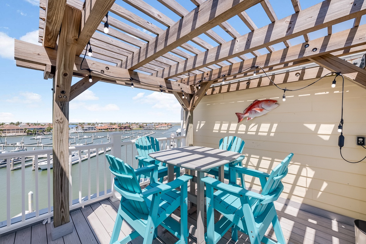 Unwind on your private rooftop deck with chairs and marina views, perfect for morning coffee or sunset dining.