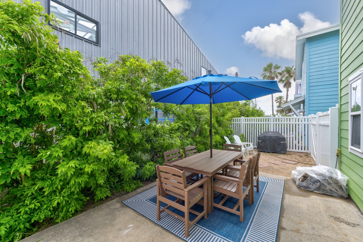 Your private outdoor dining spot awaits with shade and sunshine—perfect for morning coffee, alfresco lunches, or evening grills under the coastal sky.