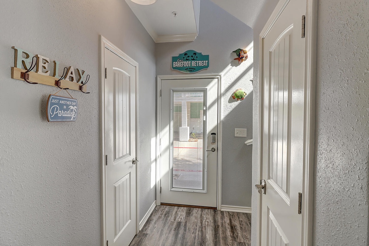 Step into your tropical escape through this welcoming entry, where coastal charm meets comfort in every detail.